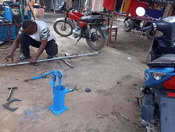 Technician replacing pump parts in Toamasina